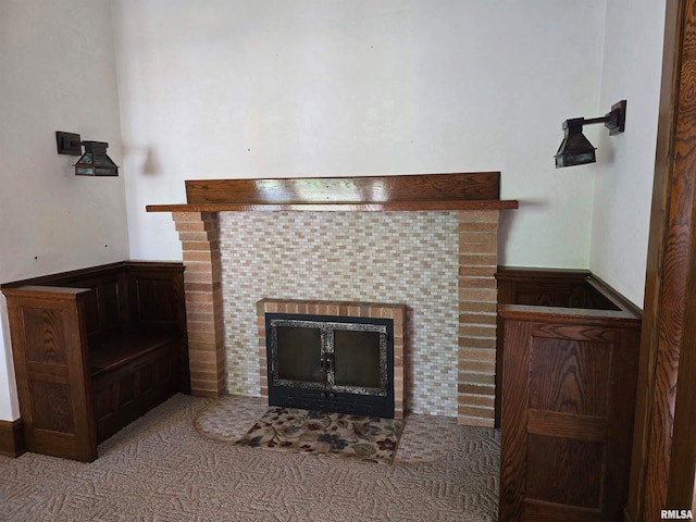 details with a tile fireplace