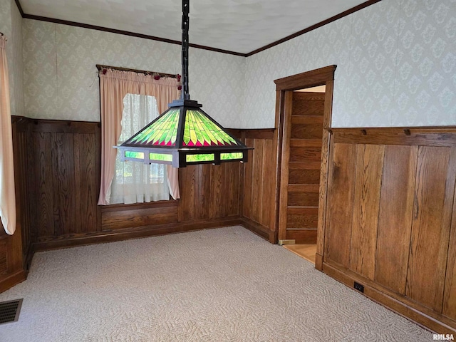 interior space featuring wooden walls and crown molding