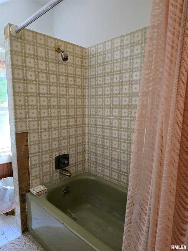 bathroom featuring tile patterned floors and shower / bath combo