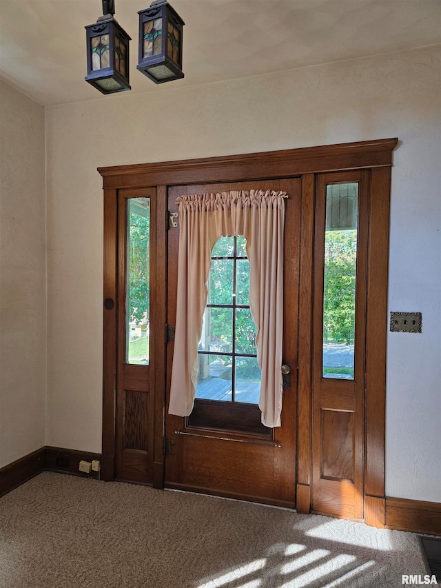 view of carpeted foyer