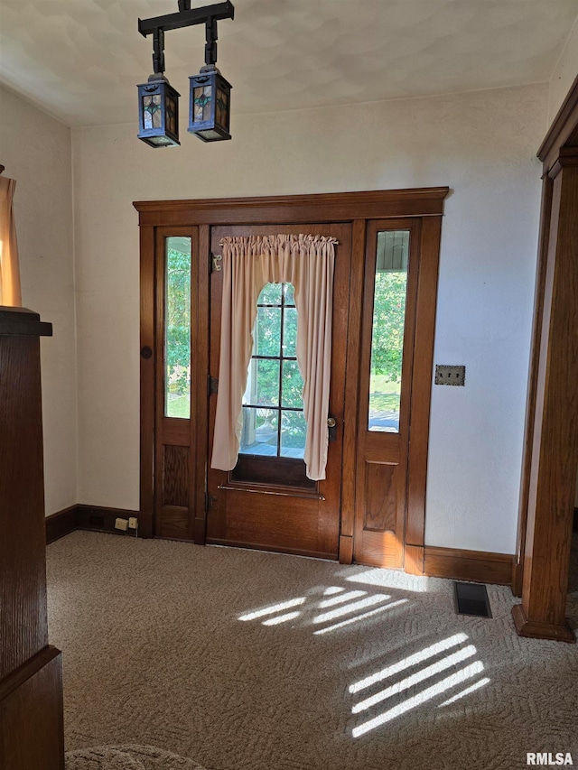 entryway featuring carpet flooring