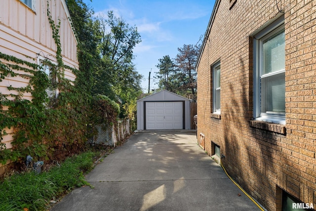 exterior space with a garage and an outdoor structure