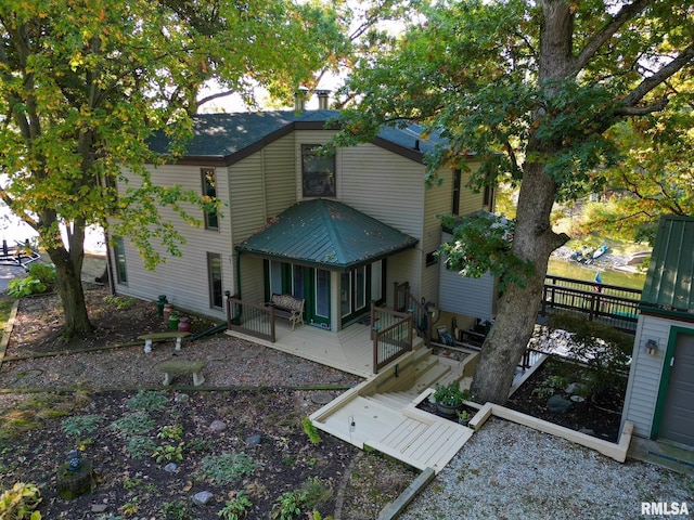 rear view of house with a deck