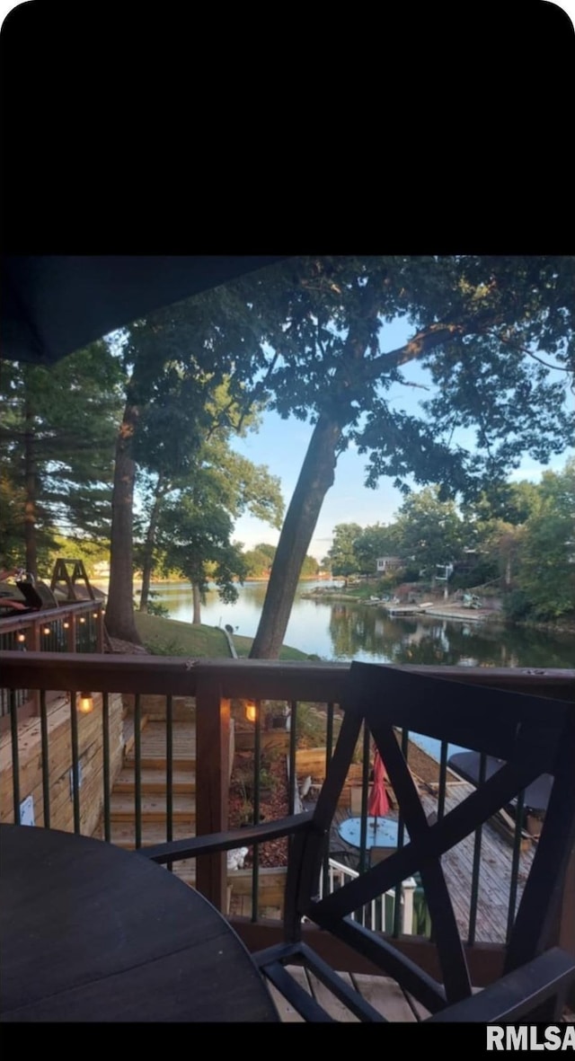 balcony featuring a water view