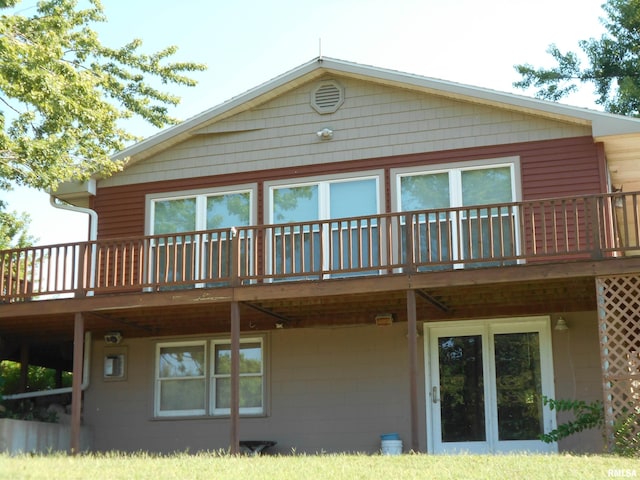 back of property with a wooden deck