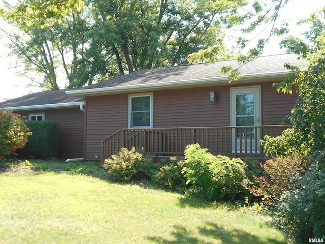 view of property exterior with a yard