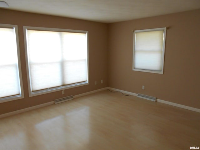 spare room with light hardwood / wood-style floors