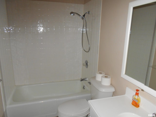 full bathroom featuring toilet, vanity, and tiled shower / bath combo