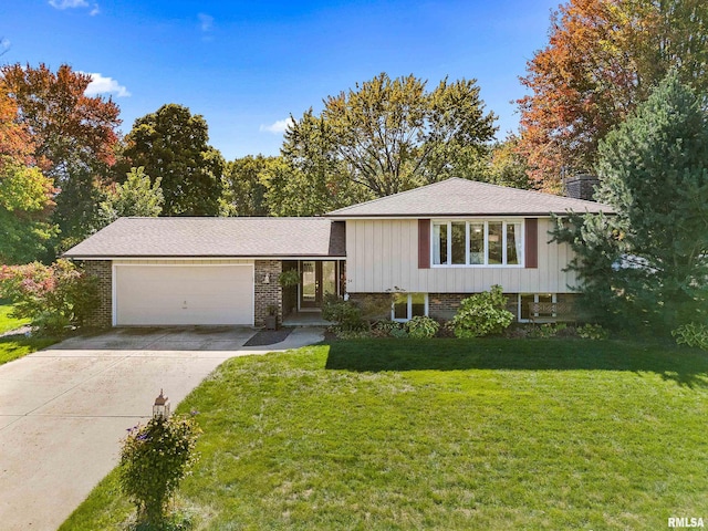 split level home with a front yard and a garage