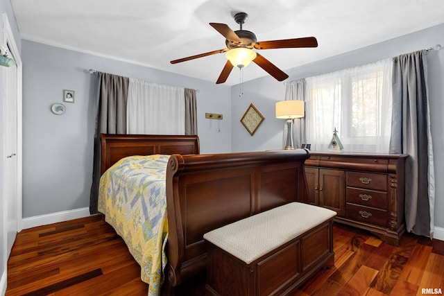 bedroom featuring dark wood-type flooring and ceiling fan