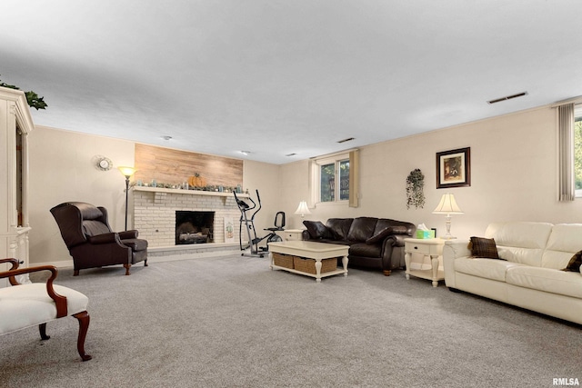 carpeted living room with a brick fireplace