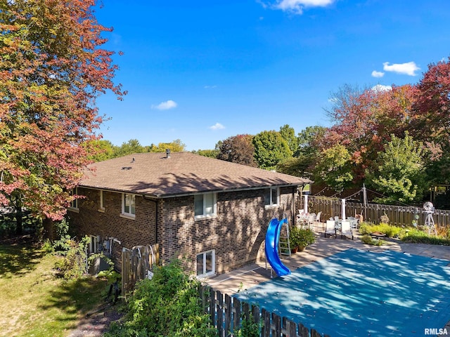 back of property featuring a patio