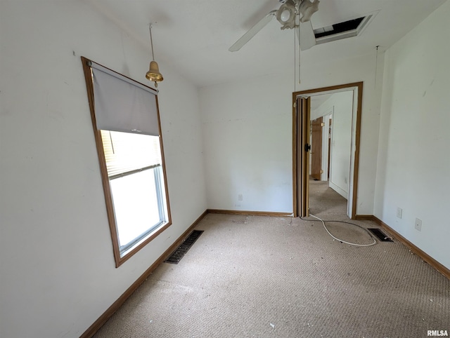 empty room featuring light carpet and ceiling fan