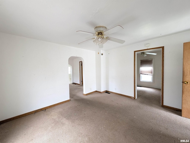 spare room with carpet flooring and ceiling fan