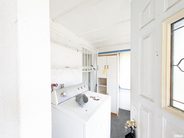 laundry room featuring washer / clothes dryer and dark carpet