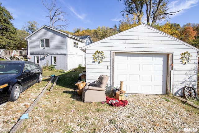 view of front of property featuring an outbuilding and a garage