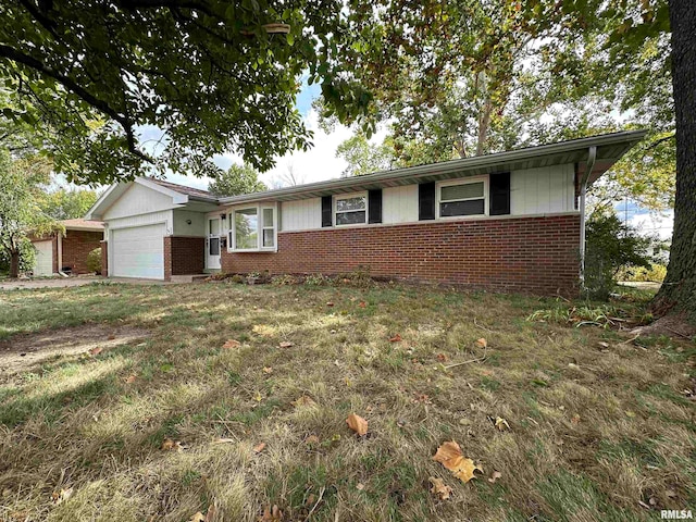 ranch-style home with a garage and a front lawn