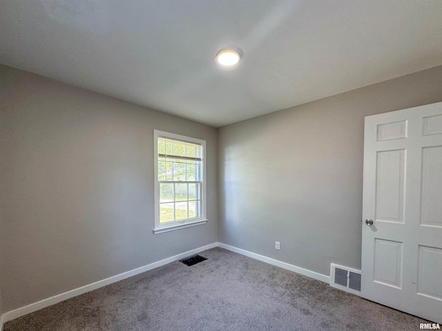 empty room featuring carpet floors