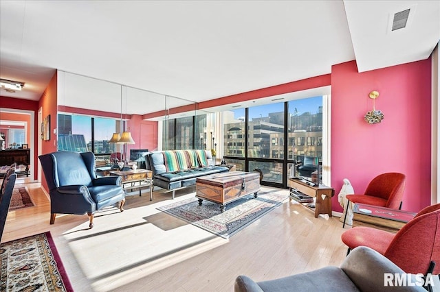 living room with light hardwood / wood-style flooring