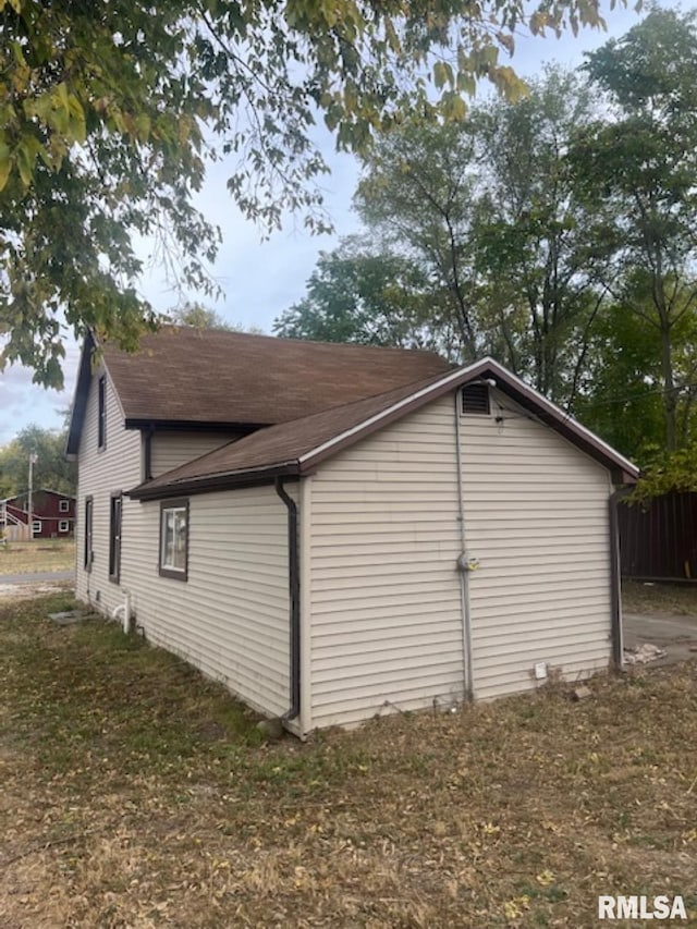 view of property exterior featuring a yard