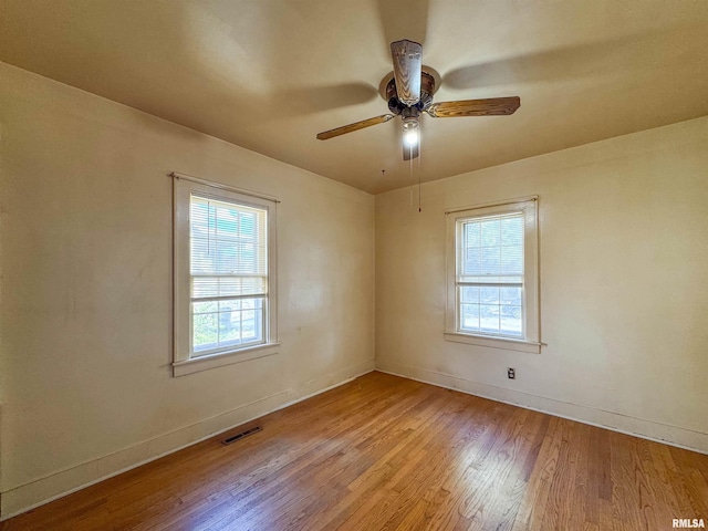 unfurnished room featuring ceiling fan and light wood-type flooring