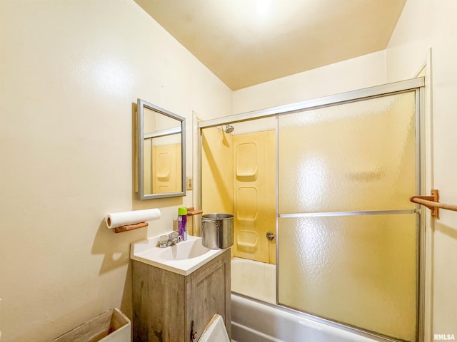 bathroom featuring shower / bath combination with glass door and vanity