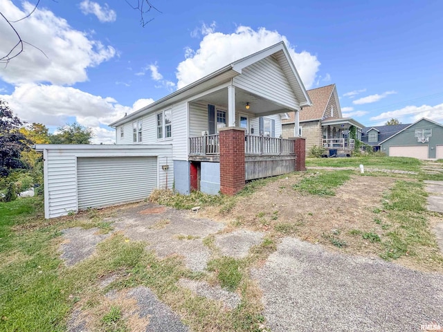 view of side of home featuring a porch