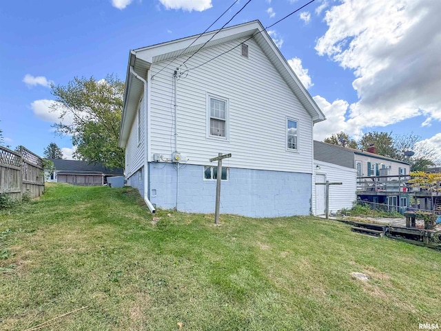 back of house with a yard