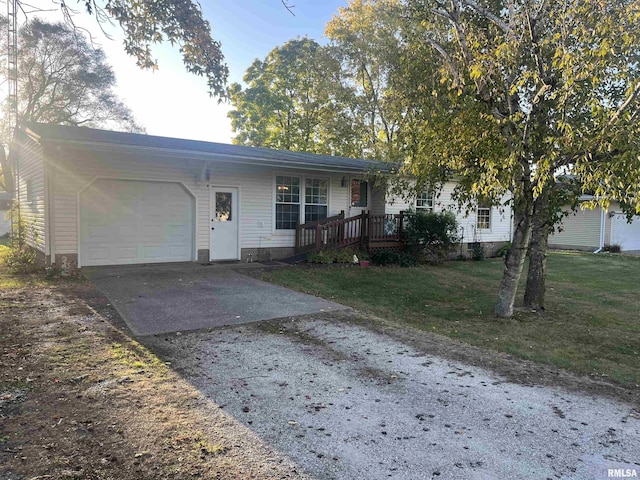 view of front of home with a garage and a front yard