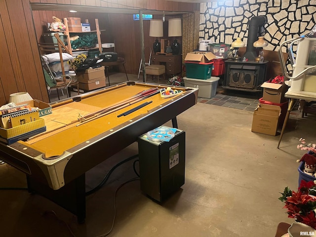 game room with wooden walls, concrete flooring, and pool table