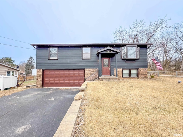 raised ranch featuring a garage