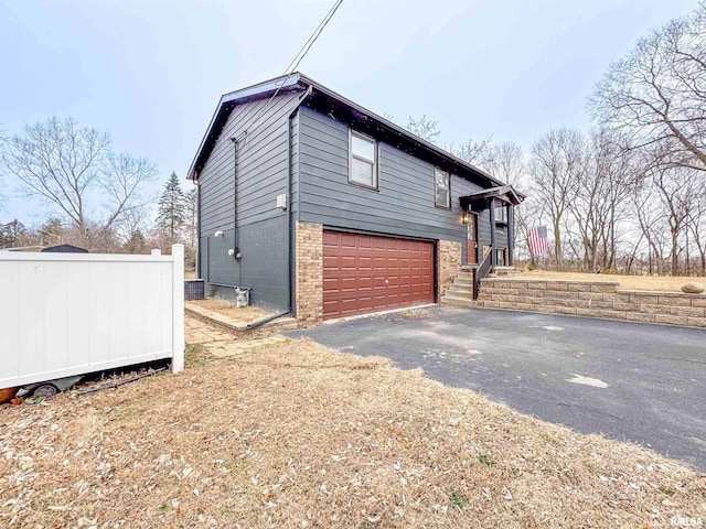 view of side of property featuring a garage