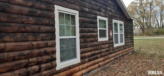 view of side of property featuring a yard