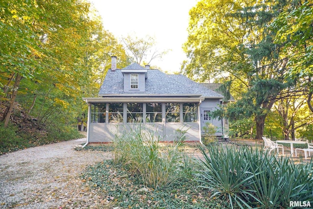 view of front of property featuring a sunroom