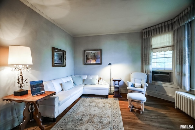 living room featuring radiator, ornamental molding, cooling unit, and dark hardwood / wood-style floors