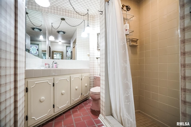 bathroom featuring vanity, curtained shower, and toilet