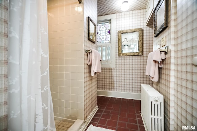 bathroom with tile patterned flooring, radiator heating unit, and a shower with curtain