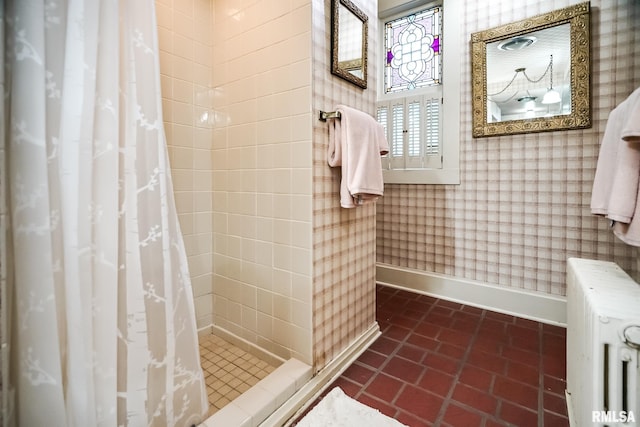 bathroom with curtained shower and radiator heating unit