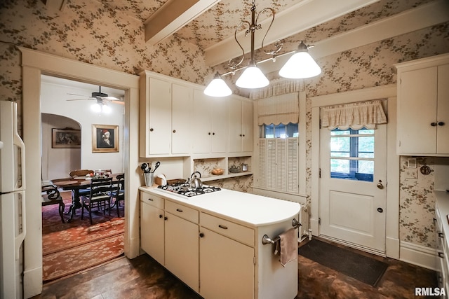 kitchen with white gas cooktop, ceiling fan, and pendant lighting