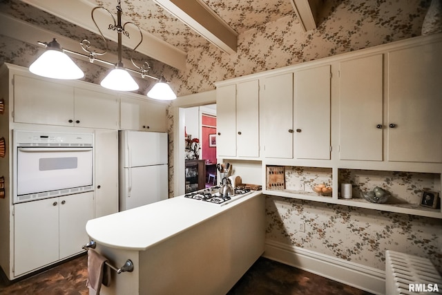 kitchen with kitchen peninsula, pendant lighting, white cabinetry, radiator heating unit, and white appliances