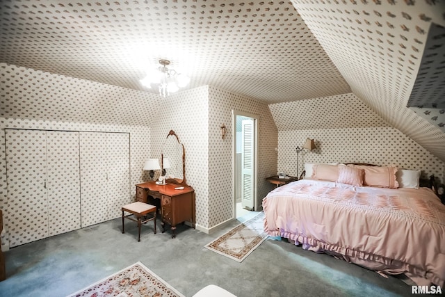 carpeted bedroom with lofted ceiling