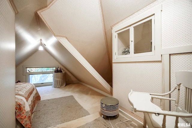 bonus room with lofted ceiling and carpet floors