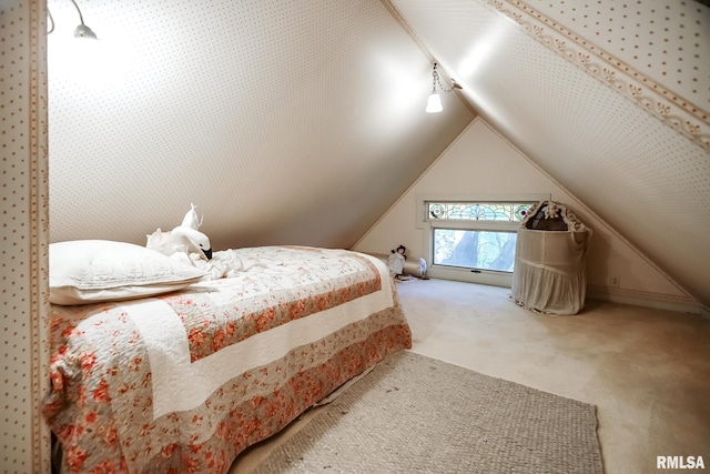 bedroom featuring lofted ceiling and carpet floors