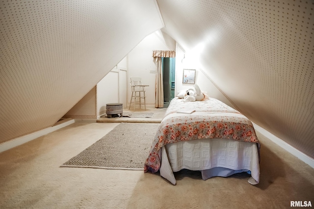 carpeted bedroom with vaulted ceiling