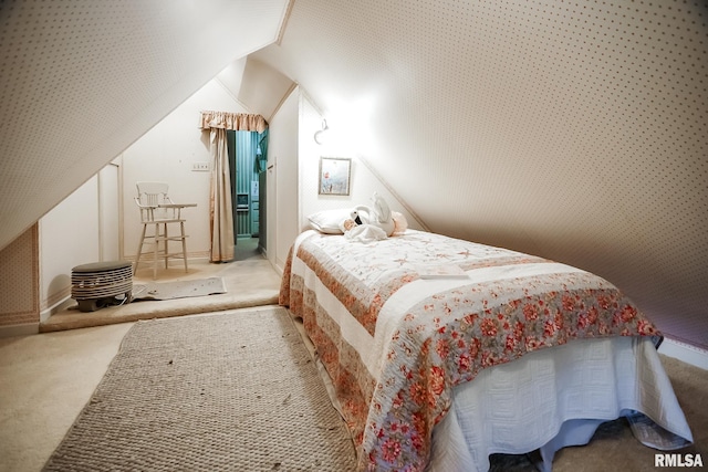 bedroom with light carpet and lofted ceiling