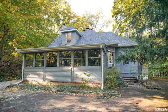 view of front facade featuring a sunroom