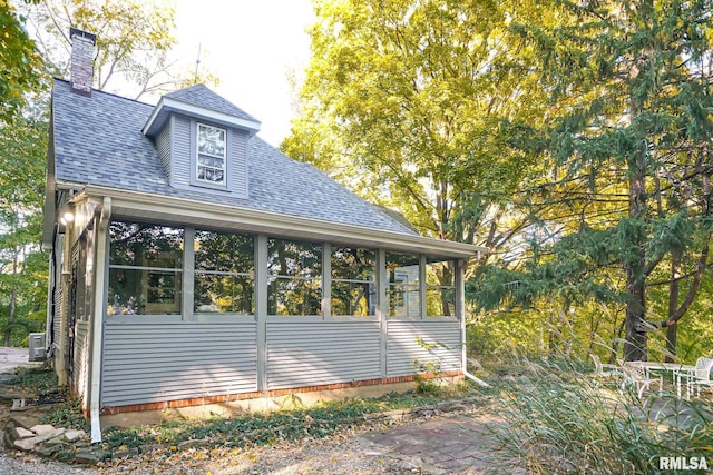 view of home's exterior featuring a sunroom