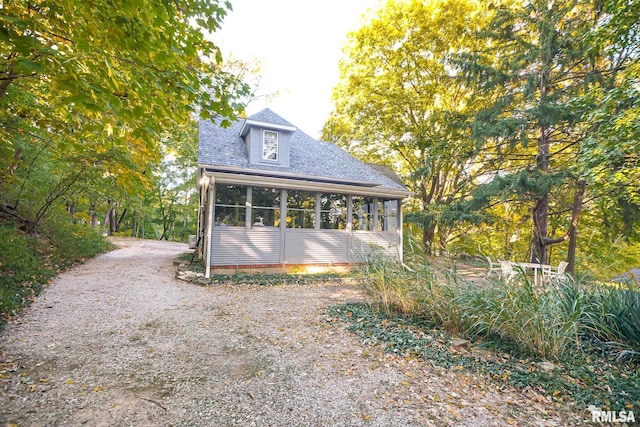 view of front of home featuring a sunroom