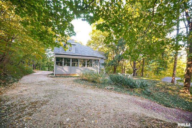 exterior space featuring a sunroom