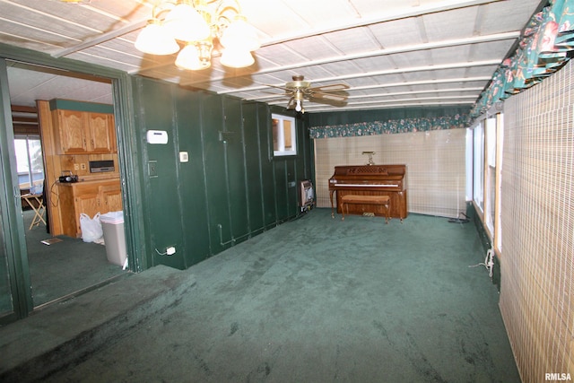 basement featuring carpet and ceiling fan